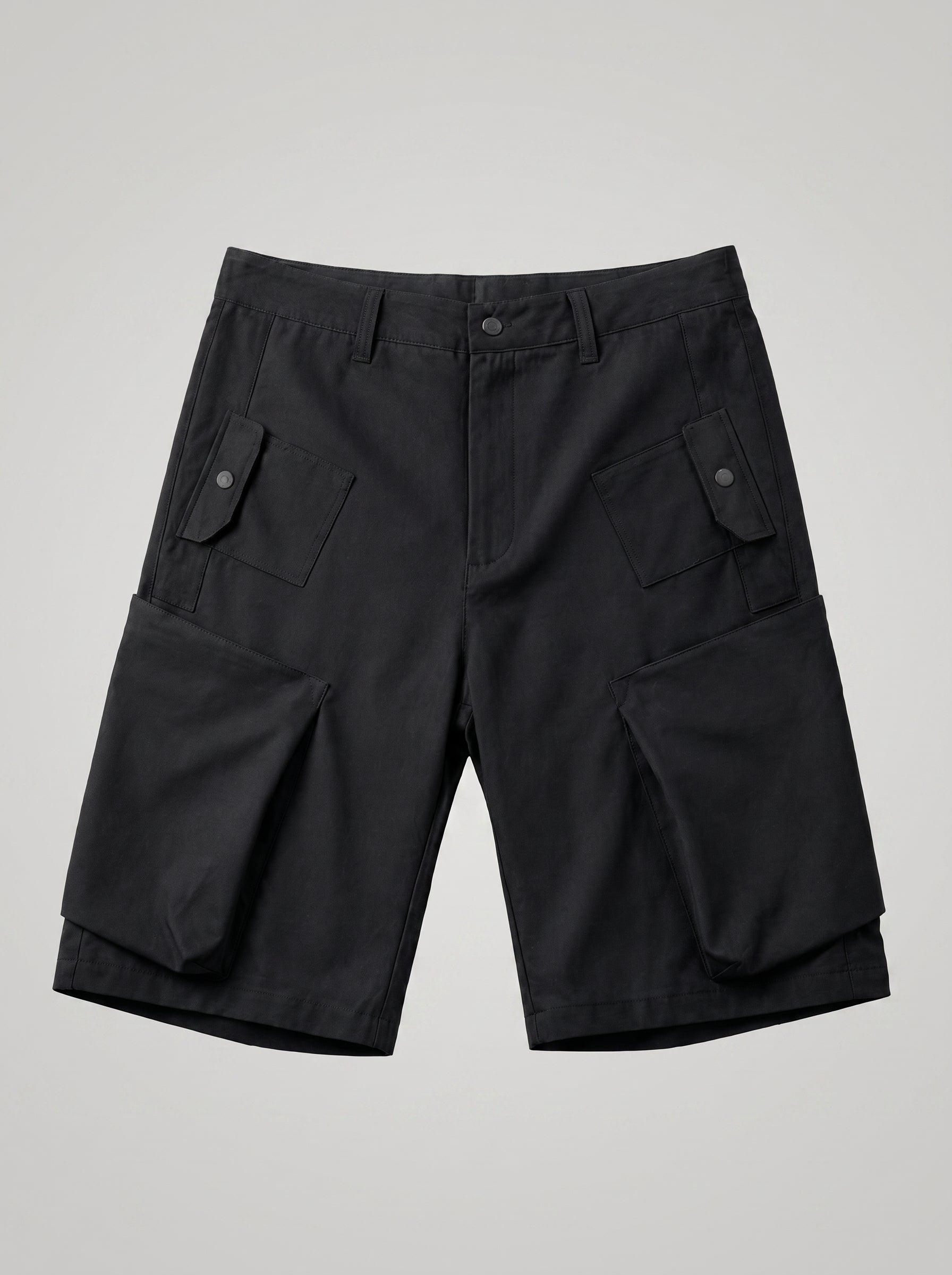 Black cargo shorts on a light gray background