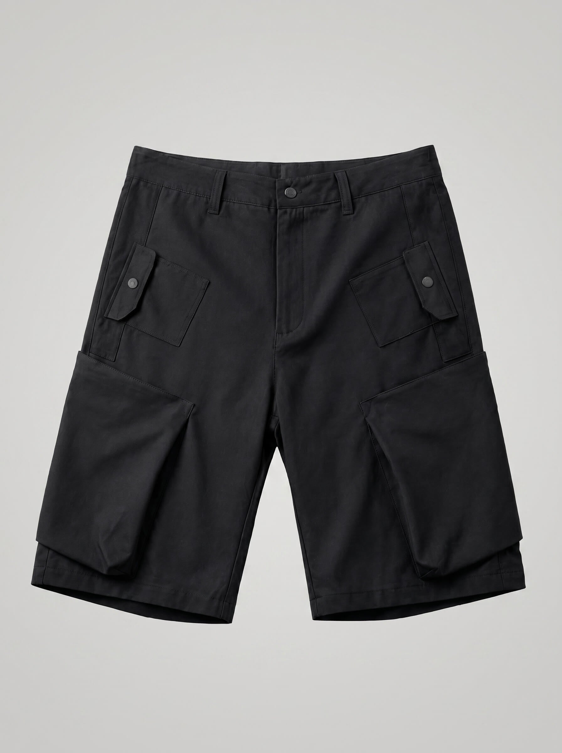Black cargo shorts on a light gray background