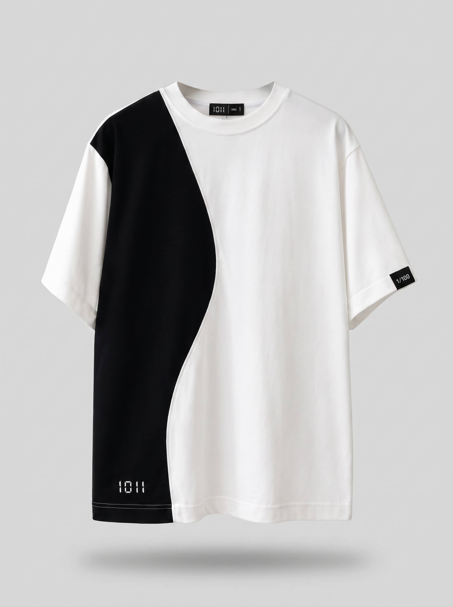 Black and white t-shirt with a geometric design on a gray background