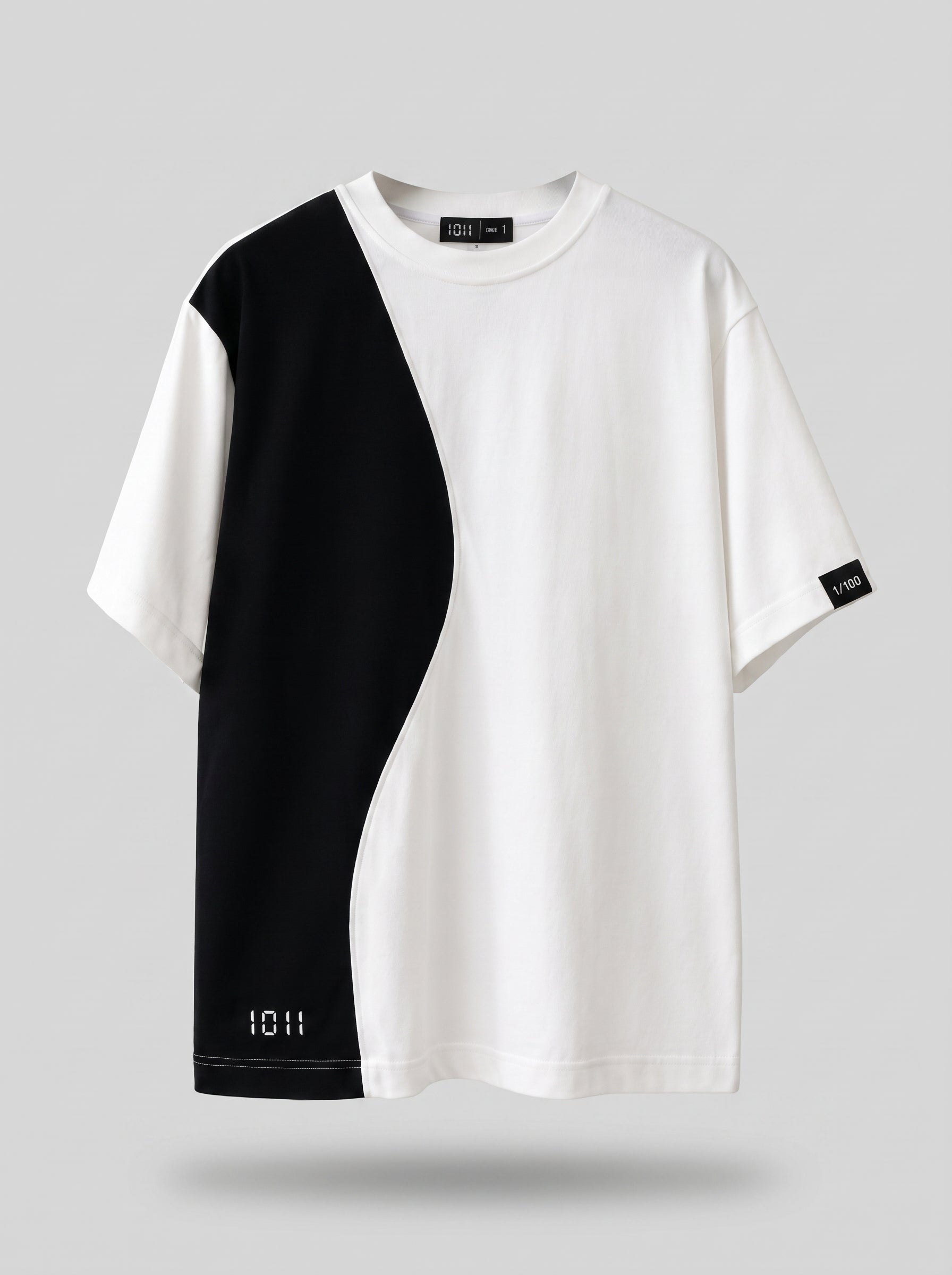 Black and white t-shirt with a geometric design on a gray background