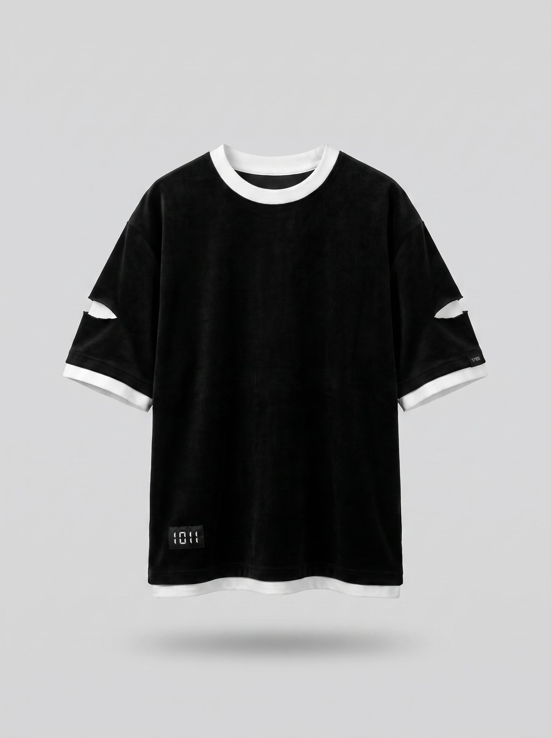 Black t-shirt with white trim on a light gray background