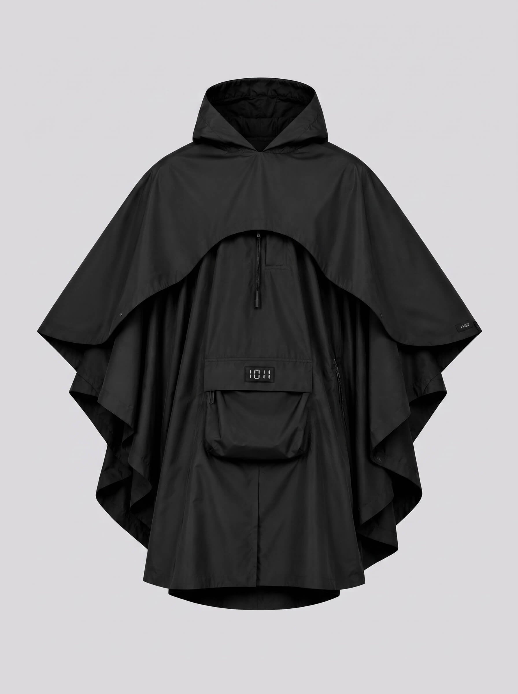 Black poncho with a hood on a light gray background